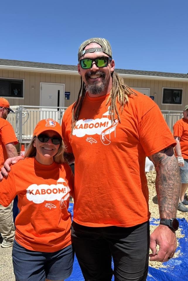 Danielle Lammon with Derek Wolfe at a community volunteer event.